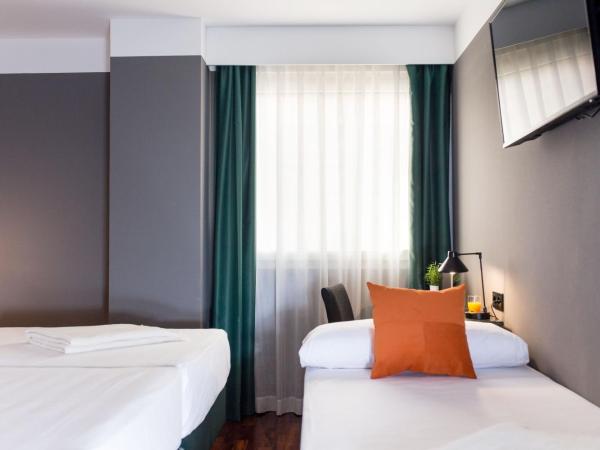 Hotel Malcom and Barret : photo 7 de la chambre chambre triple