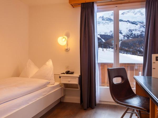 Hotel THE LARIX ski-in ski-out : photo 1 de la chambre chambre simple sud
