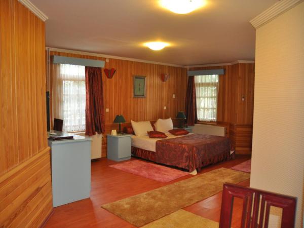 Ulasan Hotel Caravan Camping : photo 4 de la chambre chambre double - vue sur jardin