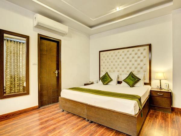 Treebo C T International : photo 2 de la chambre chambre deluxe double ou lits jumeaux