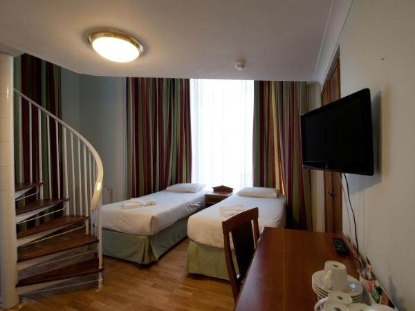 Royal Eagle Hotel : photo 1 de la chambre chambre quadruple