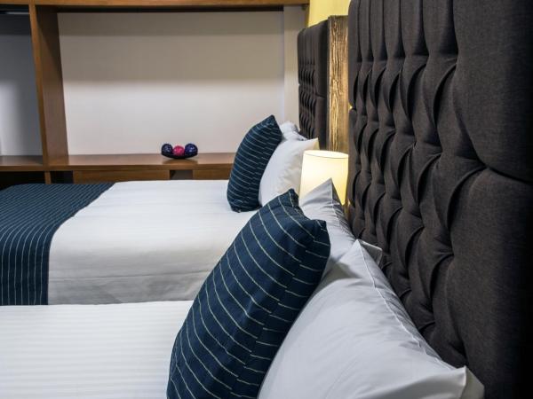 Hotel Casa Aurora : photo 6 de la chambre chambre avec 2 grands lits queen-size