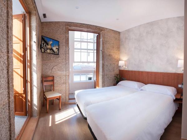 Pensión O Códice : photo 2 de la chambre chambre lits jumeaux supérieure