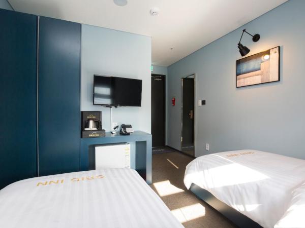 Grid Inn Hotel : photo 4 de la chambre chambre lits jumeaux