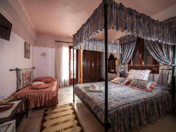 Chateau Zevgoli : photo 4 de la chambre suite junior - vue sur jardin