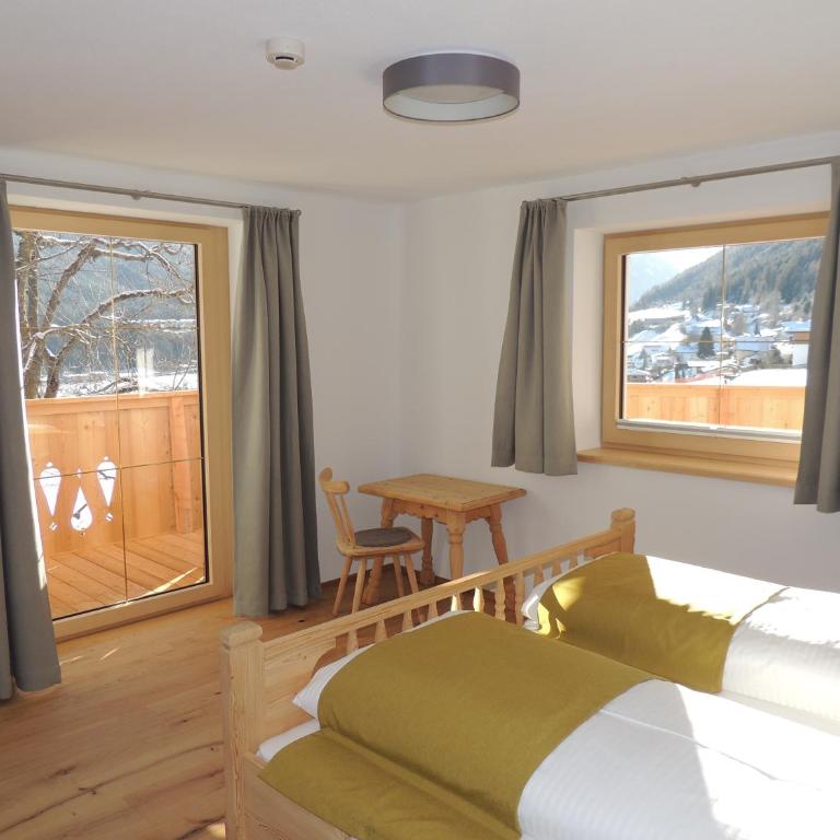 Buttererhof-Apartments - Apartment mit 2 Schlafzimmern und Balkon 1 - 24