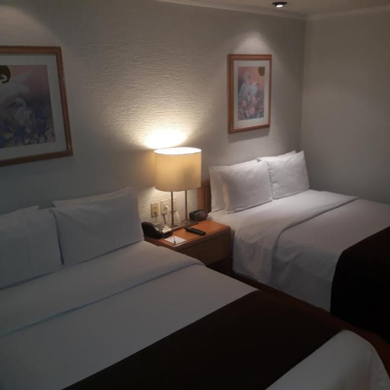 Hotel PF - Habitación Doble Estándar con 2 camas dobles - 28