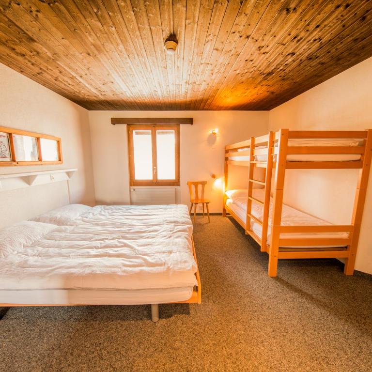 Sportchalet Mürren - Vierbettzimmer mit eigenem Bad - 1