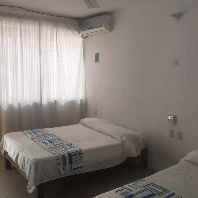 Hotel Carruiz - Habitación Doble Deluxe - 2 camas - 9