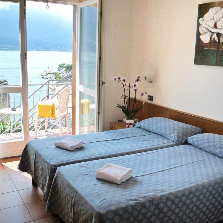 Hotel Castell - Montagnoli Group - Camera Matrimoniale/Doppia con Letti Singoli con Vista Lago. - 8