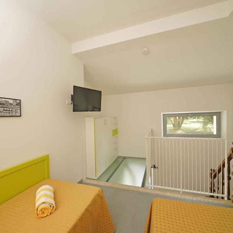 Residence Arca - Appartamento Monolocale Plus con Terrazza e Vista Giardino - 7
