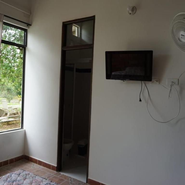Hostal Suna Vito - Habitación Doble Estándar con vistas al jardín - 2 camas - 4