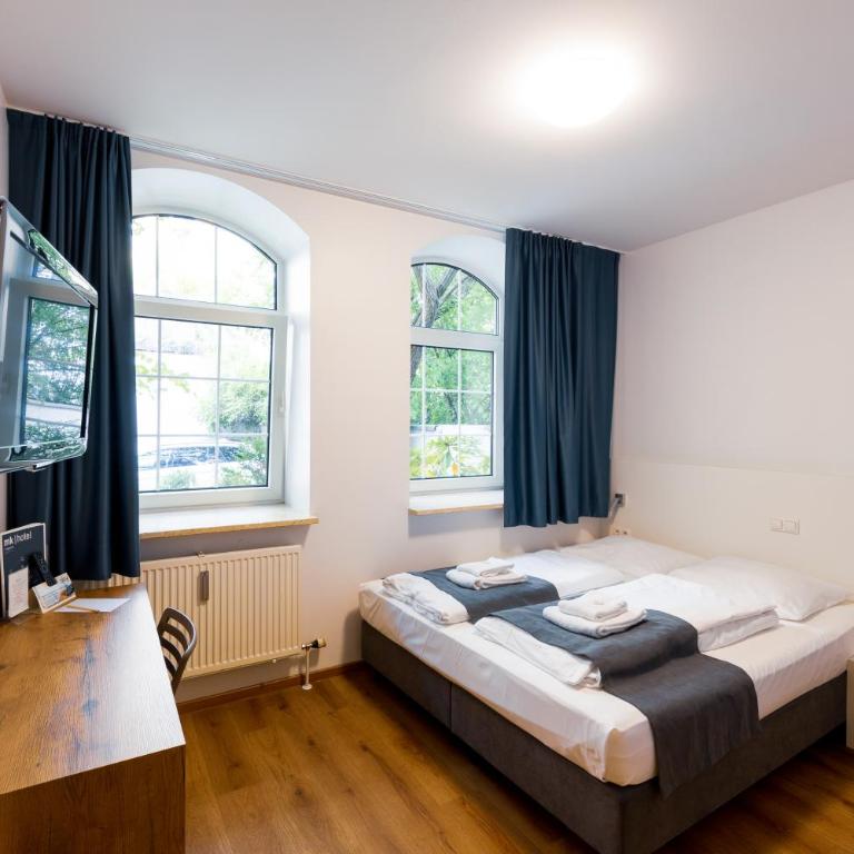 mk bed & breakfast münchen - Habitación con cama extragrande. - 1