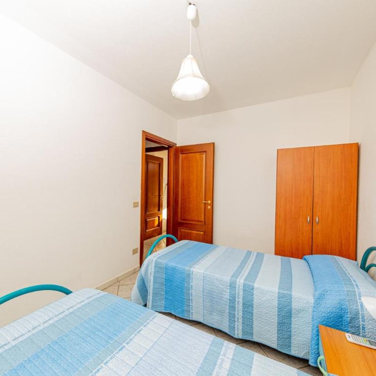 Appartamento Residenziale Trilocale 4 posti letto via Sardegna San Teodoro - Appartamento con 2 Camere da Letto e Vista Giardino - 21