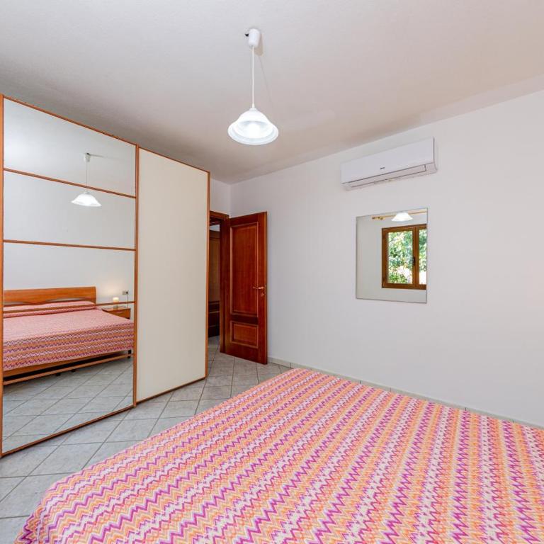 Appartamento Residenziale Trilocale 4 posti letto via Sardegna San Teodoro - Appartamento con 2 Camere da Letto e Vista Giardino - 18