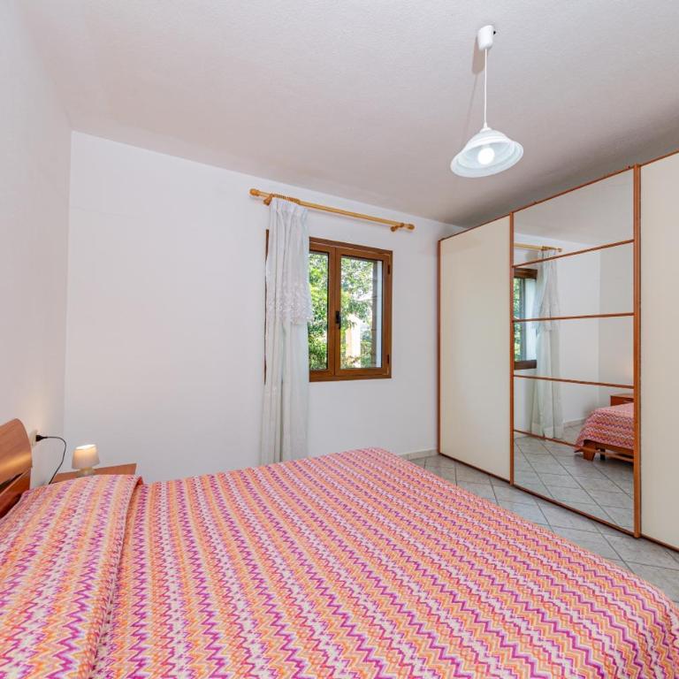 Appartamento Residenziale Trilocale 4 posti letto via Sardegna San Teodoro - Appartamento con 2 Camere da Letto e Vista Giardino - 19