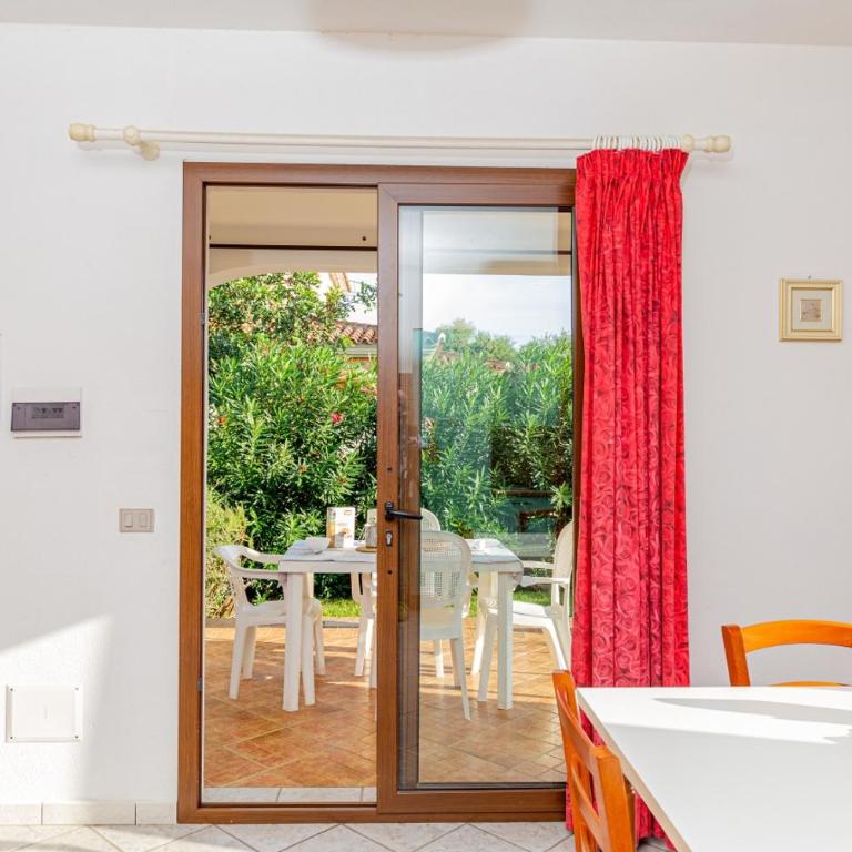 Appartamento Residenziale Trilocale 4 posti letto via Sardegna San Teodoro - Appartamento con 2 Camere da Letto e Vista Giardino - 10