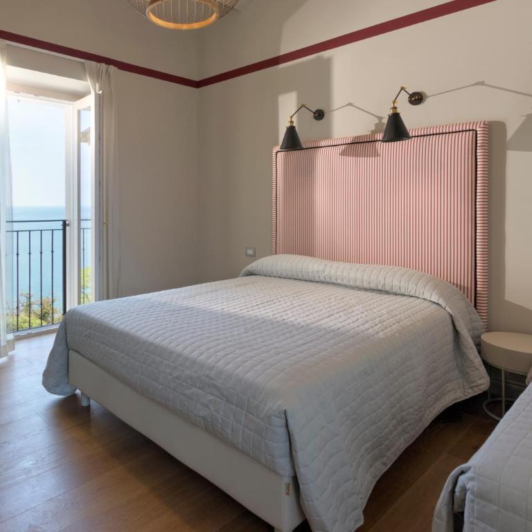Diecidodici BoutiqueRooms - Camera Tripla Superior con Vista Mare - 6