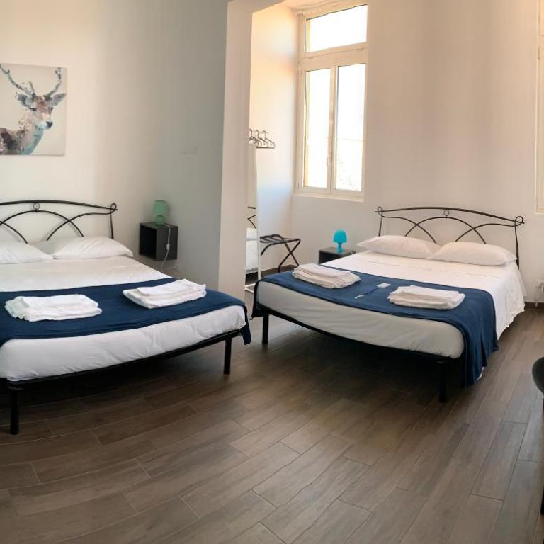 Mambo Suites - Quadruple Room with Private Bathroom - 1