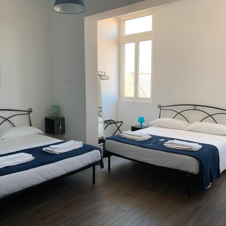 Mambo Suites - Quadruple Room with Private Bathroom - 3