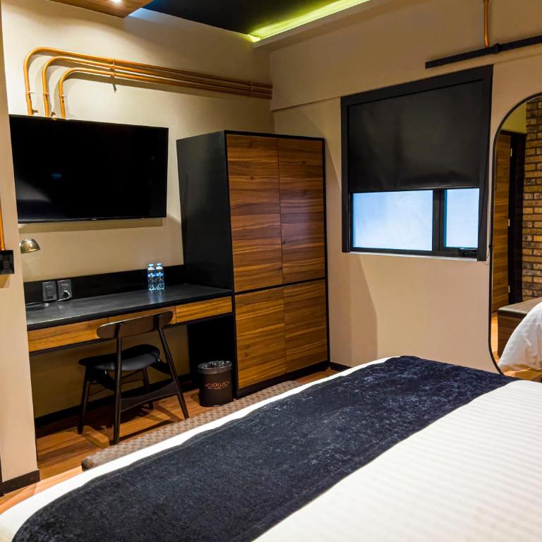 Cadillac Hotel Boutique - Suite Deluxe con cama extragrande - 2