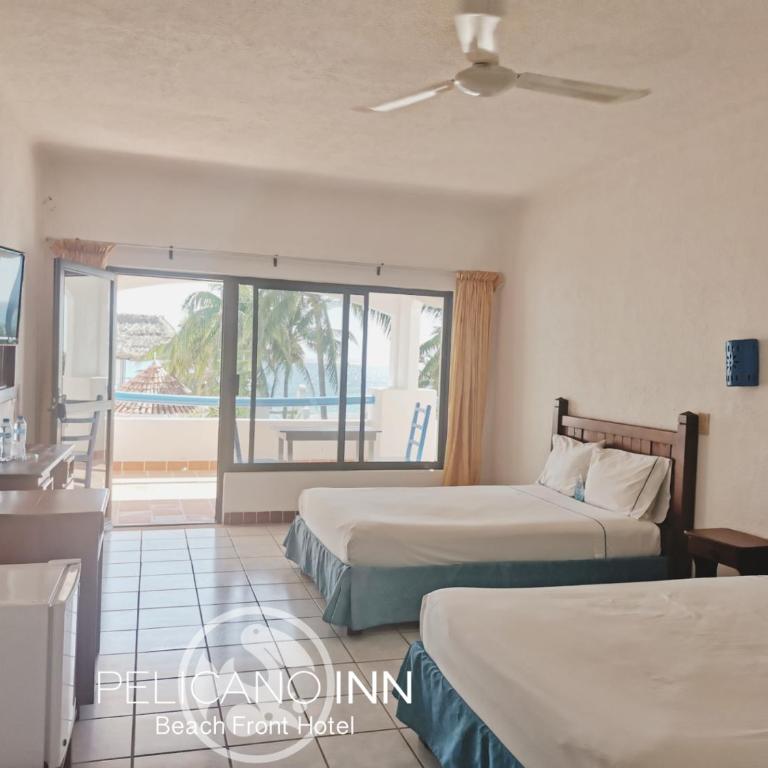 Pelicano Inn Playa del Carmen - Beachfront Hotel - Double Room with Two Double Beds and Sea View - 2