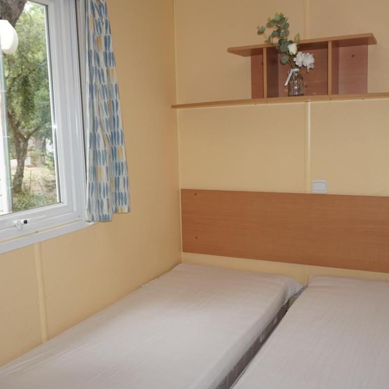 Chalets with kitchen outside at Camping Leï Suves - JoyCasa - Mobile Home - 1