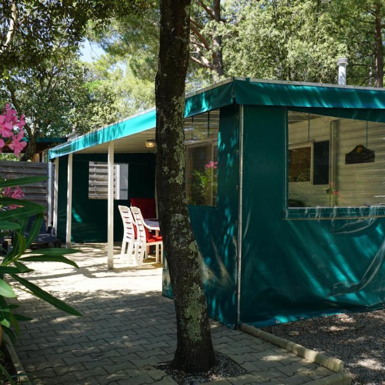 Chalets with kitchen outside at Camping Leï Suves - JoyCasa - Mobile Home - 1