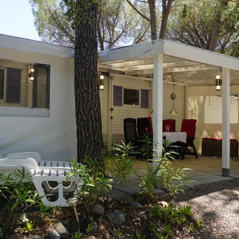 Chalets with kitchen outside at Camping Leï Suves - JoyCasa - Mobile Home - 1