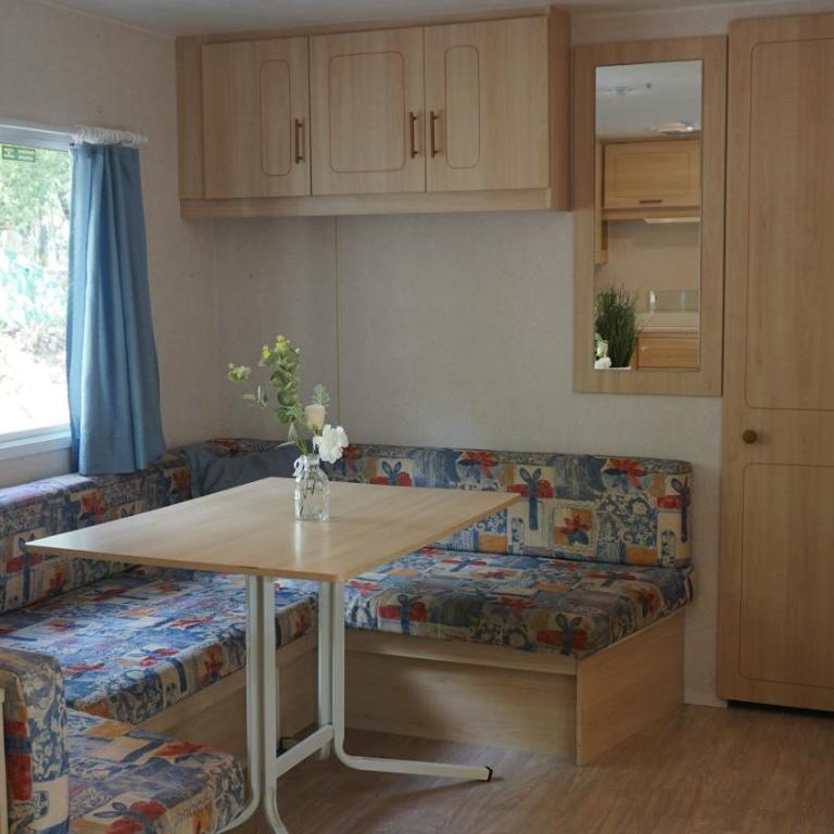 Chalets with kitchen outside at Camping Leï Suves - JoyCasa - Mobile Home - 7
