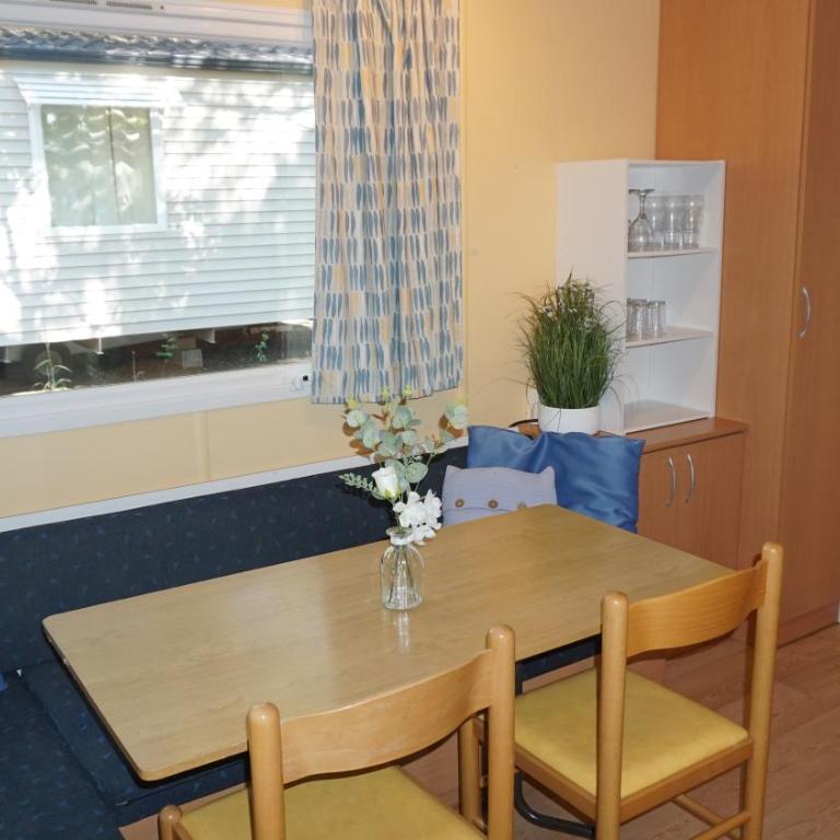 Chalets with kitchen outside at Camping Leï Suves - JoyCasa - Mobile Home - 2