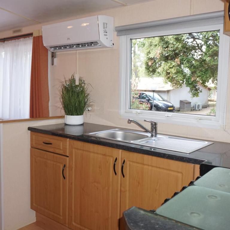 Chalets with kitchen outside at Camping Leï Suves - JoyCasa - Chalet - 2