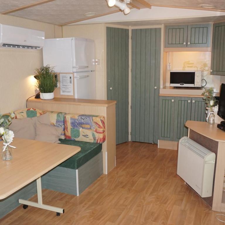 Chalets with kitchen outside at Camping Leï Suves - JoyCasa - Mobile Home - 2