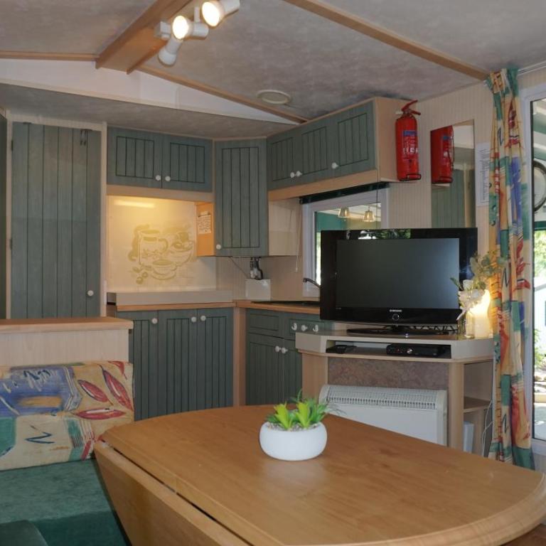 Chalets with kitchen outside at Camping Leï Suves - JoyCasa - Mobile Home - 7