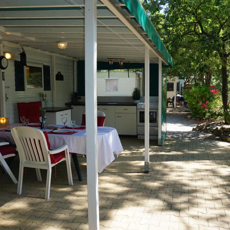 Chalets with kitchen outside at Camping Leï Suves - JoyCasa - Mobile Home - 4