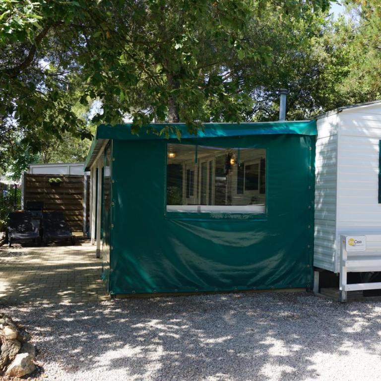 Chalets with kitchen outside at Camping Leï Suves - JoyCasa - Mobile Home - 5