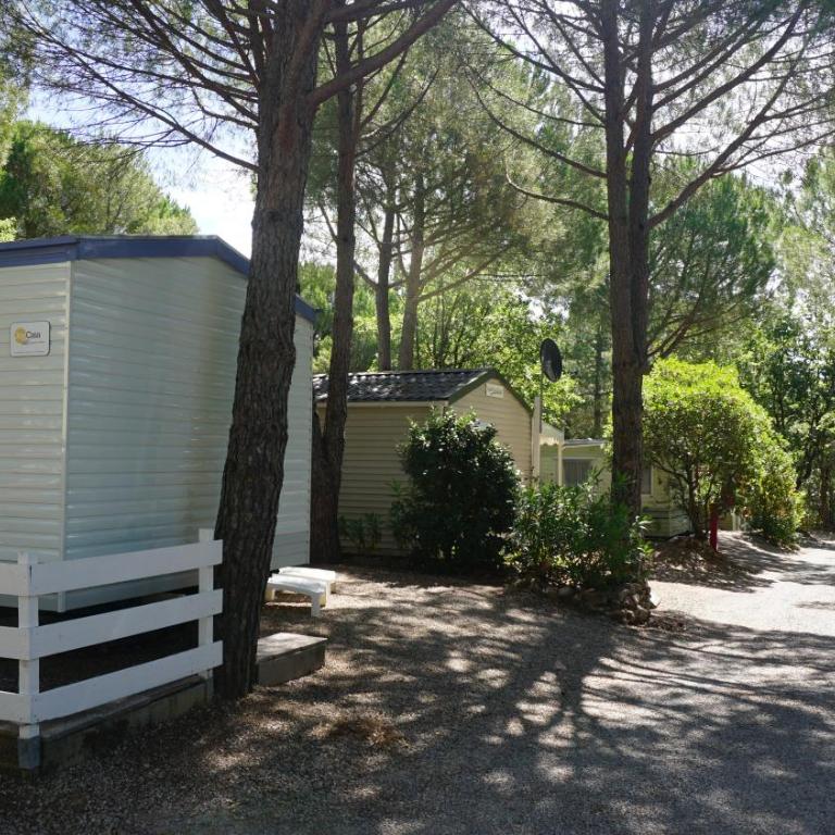 Chalets with kitchen outside at Camping Leï Suves - JoyCasa - Mobile Home - 1
