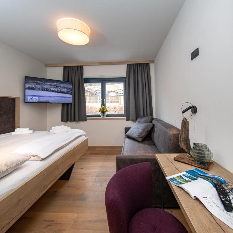 Emma Deluxe Aparthotel, Aircondition, ganzjährig beheizter Außenpool & Skibus direkt vor der Tür - Deluxe Ferienwohnung direkt am Pool - 3