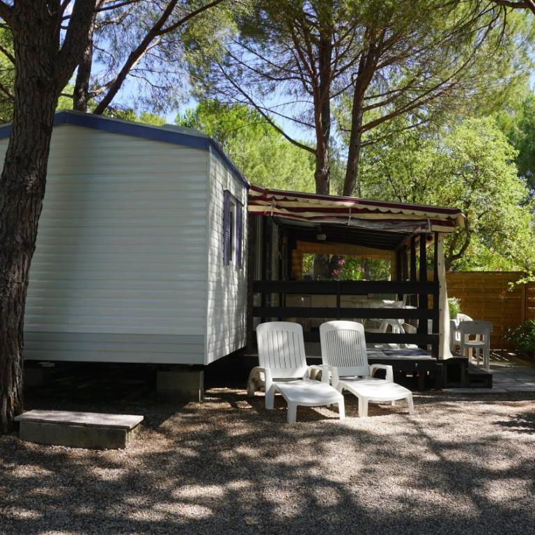 Chalets with kitchen outside at Camping Leï Suves - JoyCasa - Mobile Home - 2