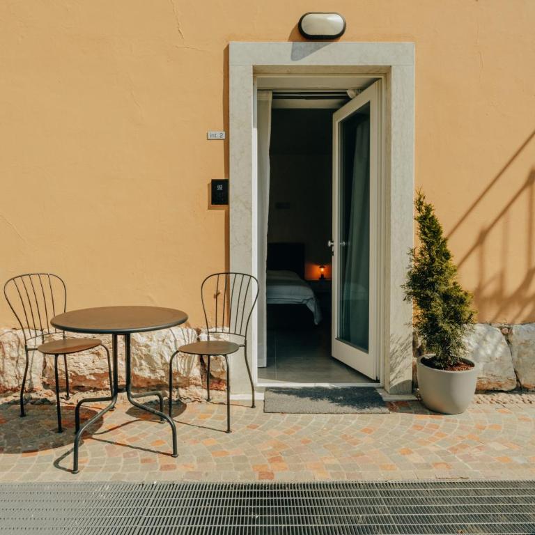 ALPENCITY SUITES - Camera Matrimoniale con Vista Giardino - 6