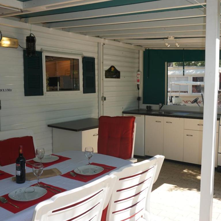 Chalets with kitchen outside at Camping Leï Suves - JoyCasa - Mobile Home - 5