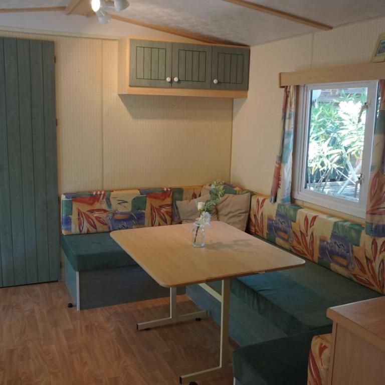 Chalets with kitchen outside at Camping Leï Suves - JoyCasa - Mobile Home - 4