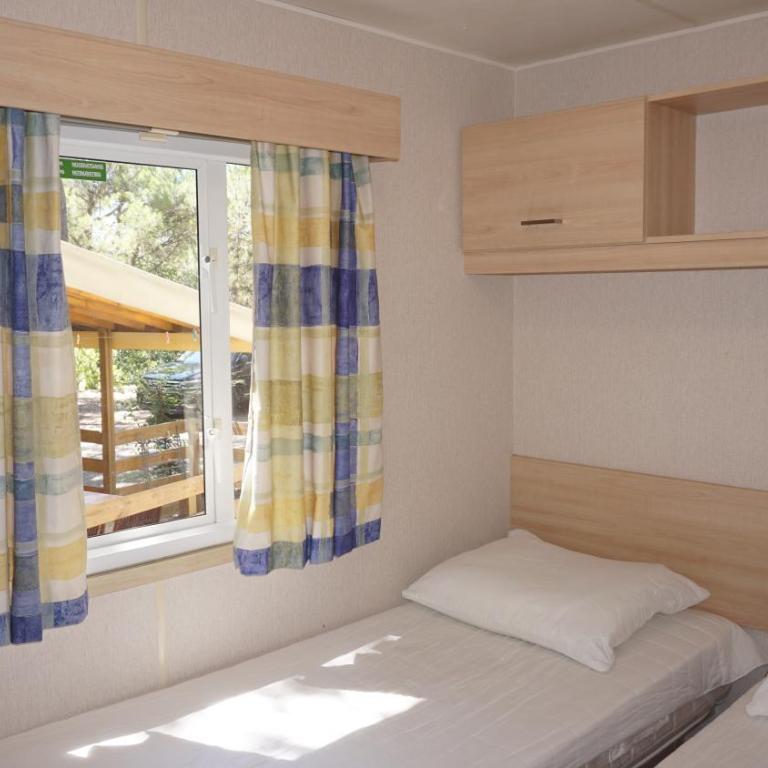 Chalets with kitchen outside at Camping Leï Suves - JoyCasa - Mobile Home - 4