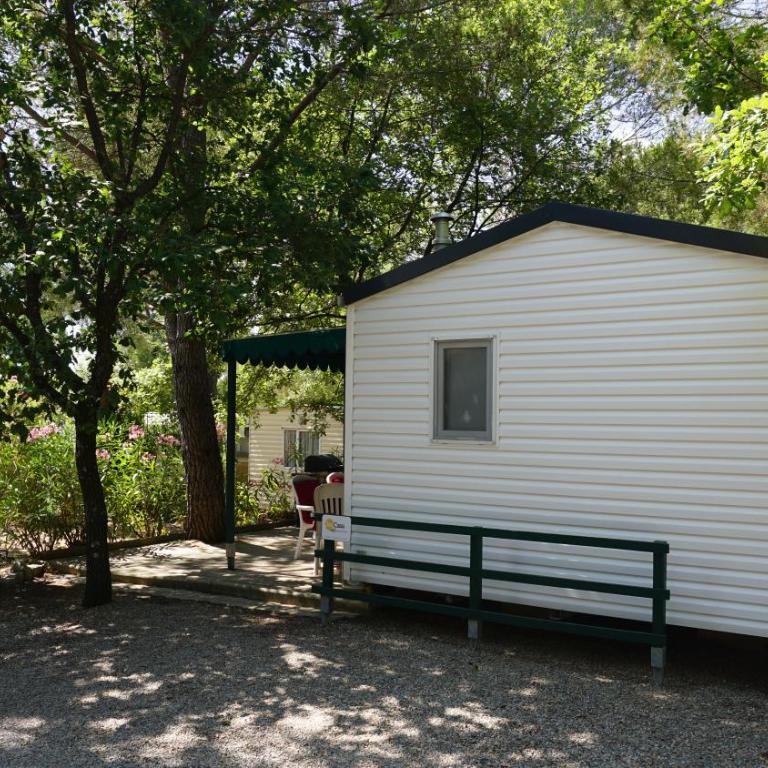 Chalets with kitchen outside at Camping Leï Suves - JoyCasa - Chalet Supérieur - 1