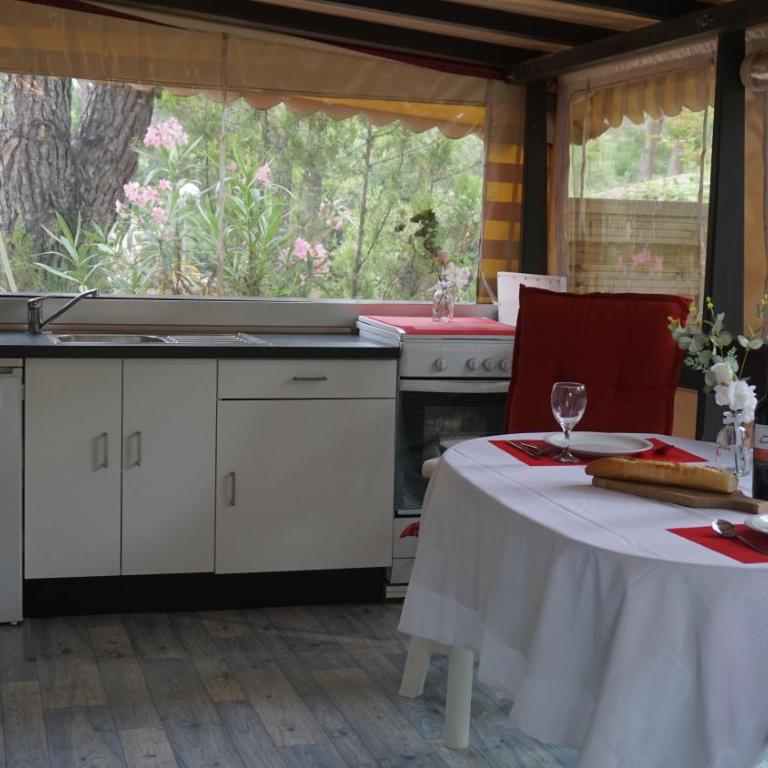 Chalets with kitchen outside at Camping Leï Suves - JoyCasa - Mobile Home - 3