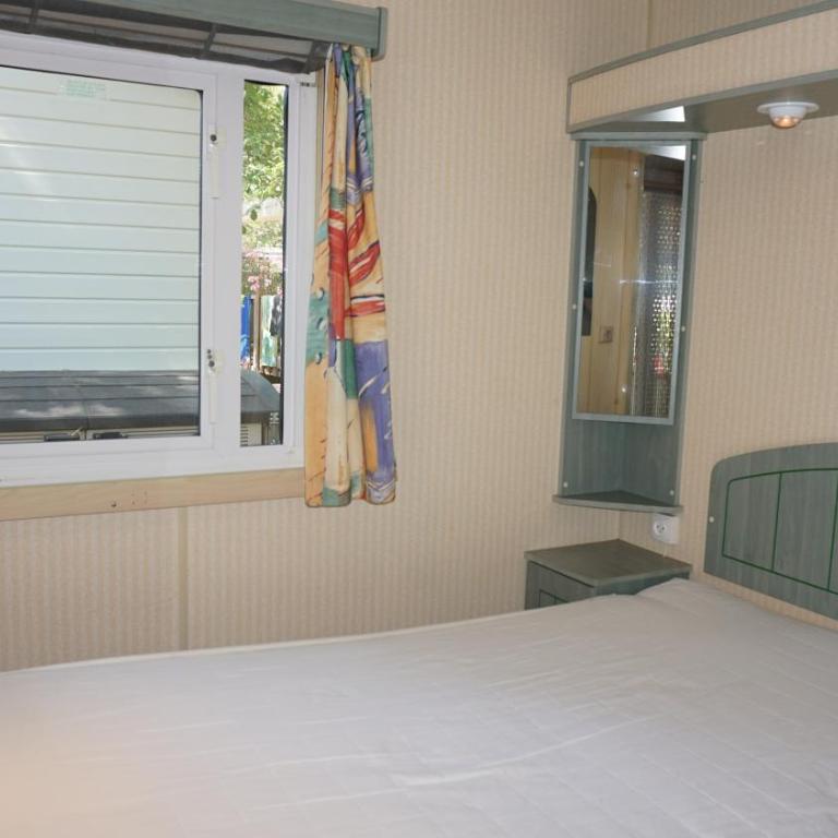Chalets with kitchen outside at Camping Leï Suves - JoyCasa - Mobile Home - 1