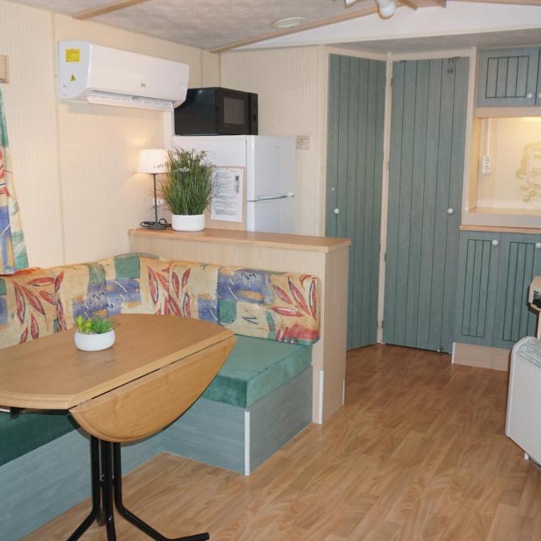 Chalets with kitchen outside at Camping Leï Suves - JoyCasa - Mobile Home - 2
