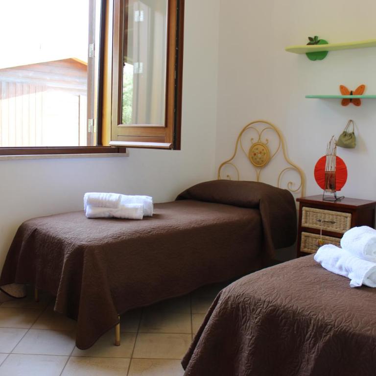 Casa Vacanze Libeccio - Villetta con giardino e piscina condominiale - Casa Vacanze - 7