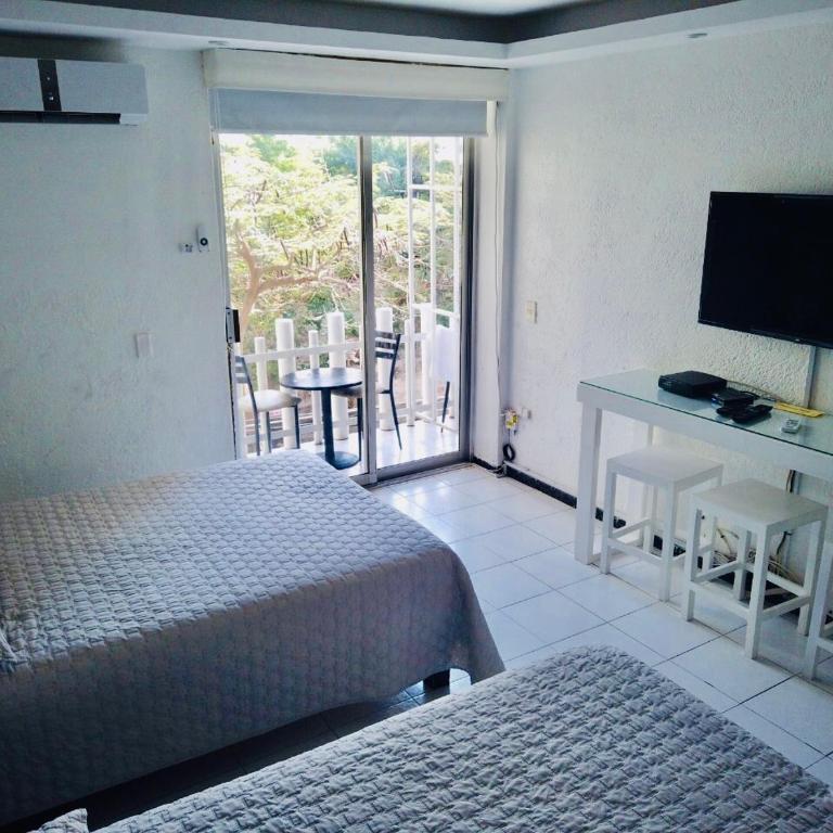 Acapulco suites Y condominio Mediterrane - Habitación Doble - 2 camas dobles - 9