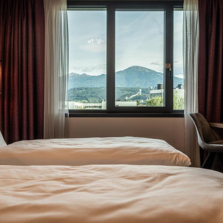 Rufi's Hotel Innsbruck - Doppelzimmer mit Bergblick - 7